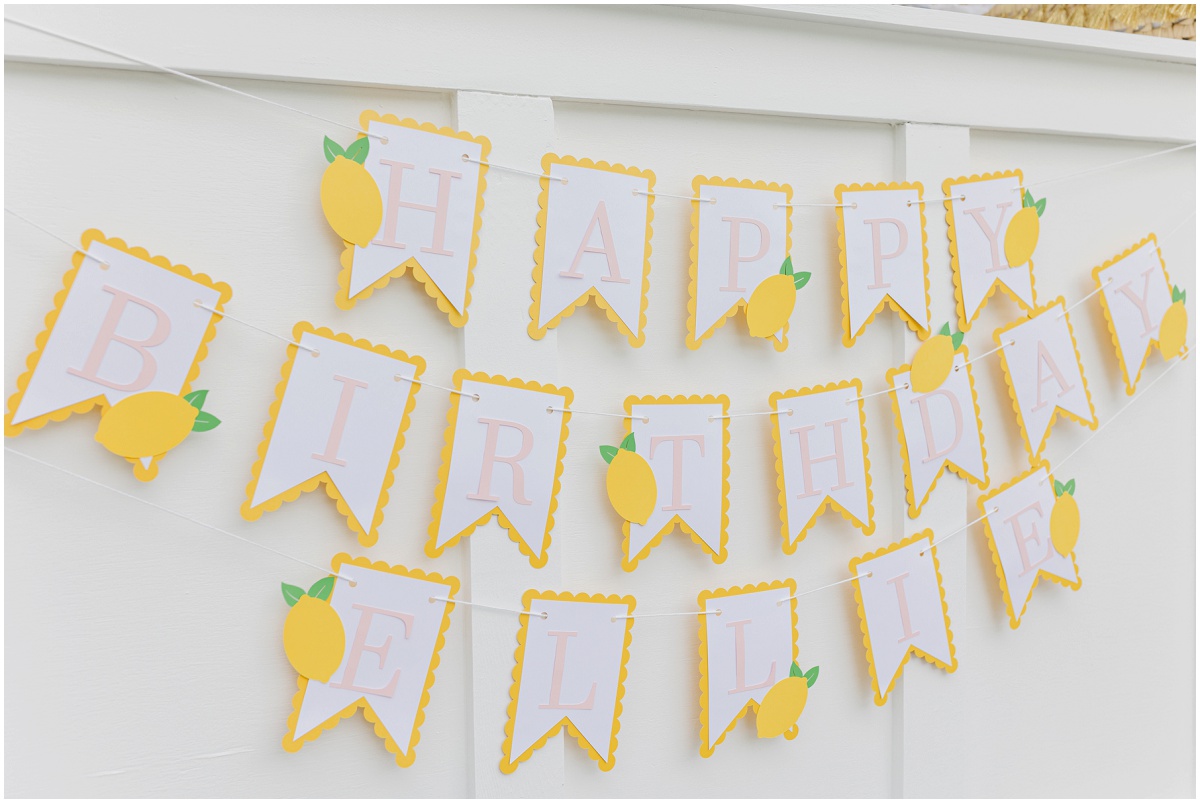 Hanging lemon flags that spell "HAPPY BIRTHDAY ELLIE"