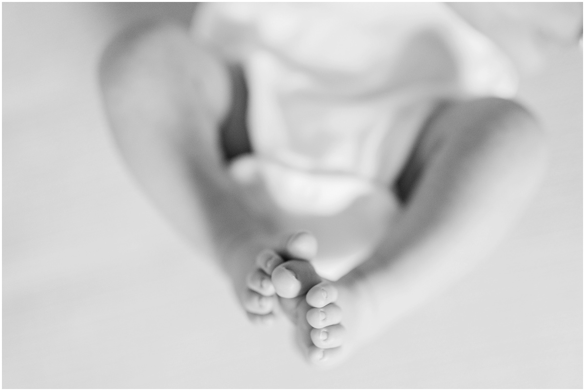 Black and white photo of newborn feet