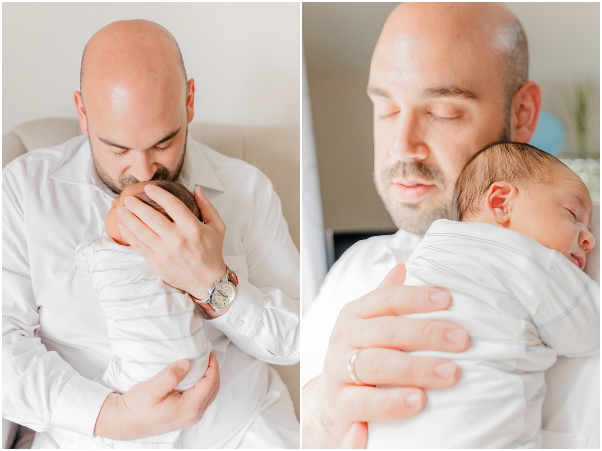 Dad holding baby's neck and head, kissing the top of the baby's head; Newborn snuggling into dad's shoulder and sleeping