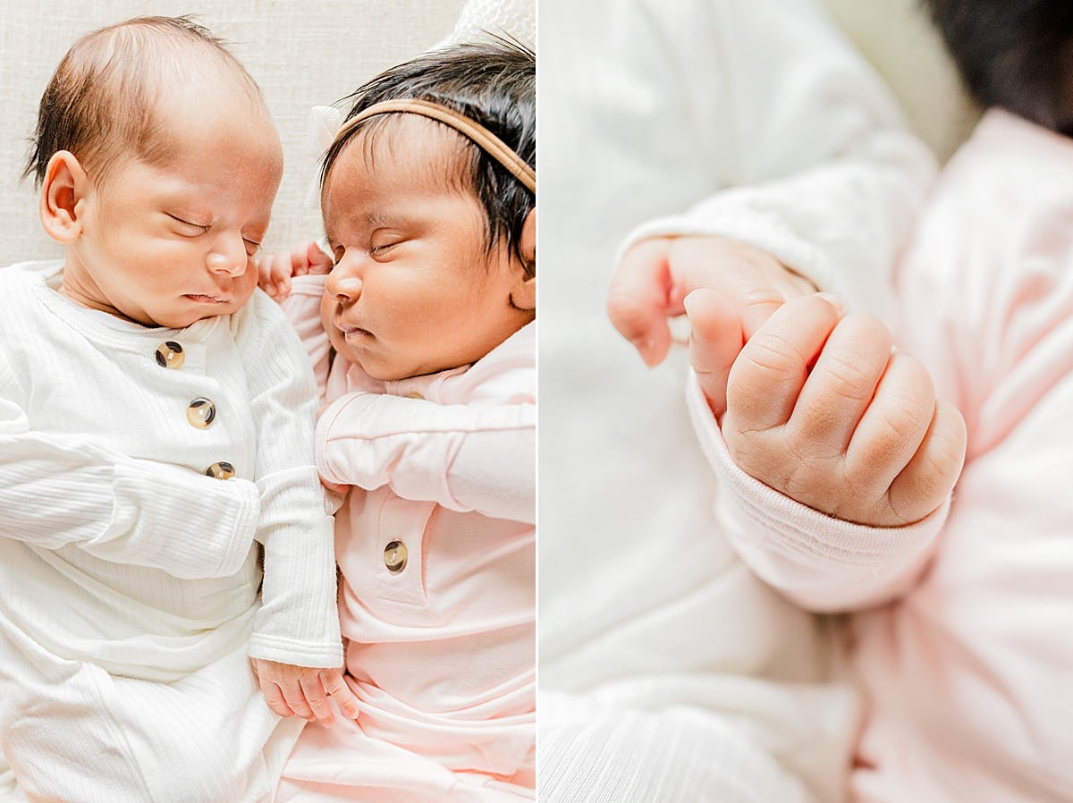 newborn twins holding on to each other and details of their hands Boston Baby Stores