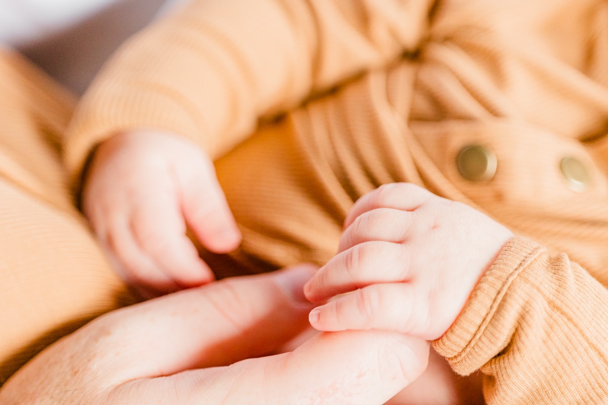 newborn baby from Harvard Vanguard OBGYN holding his mom's hand