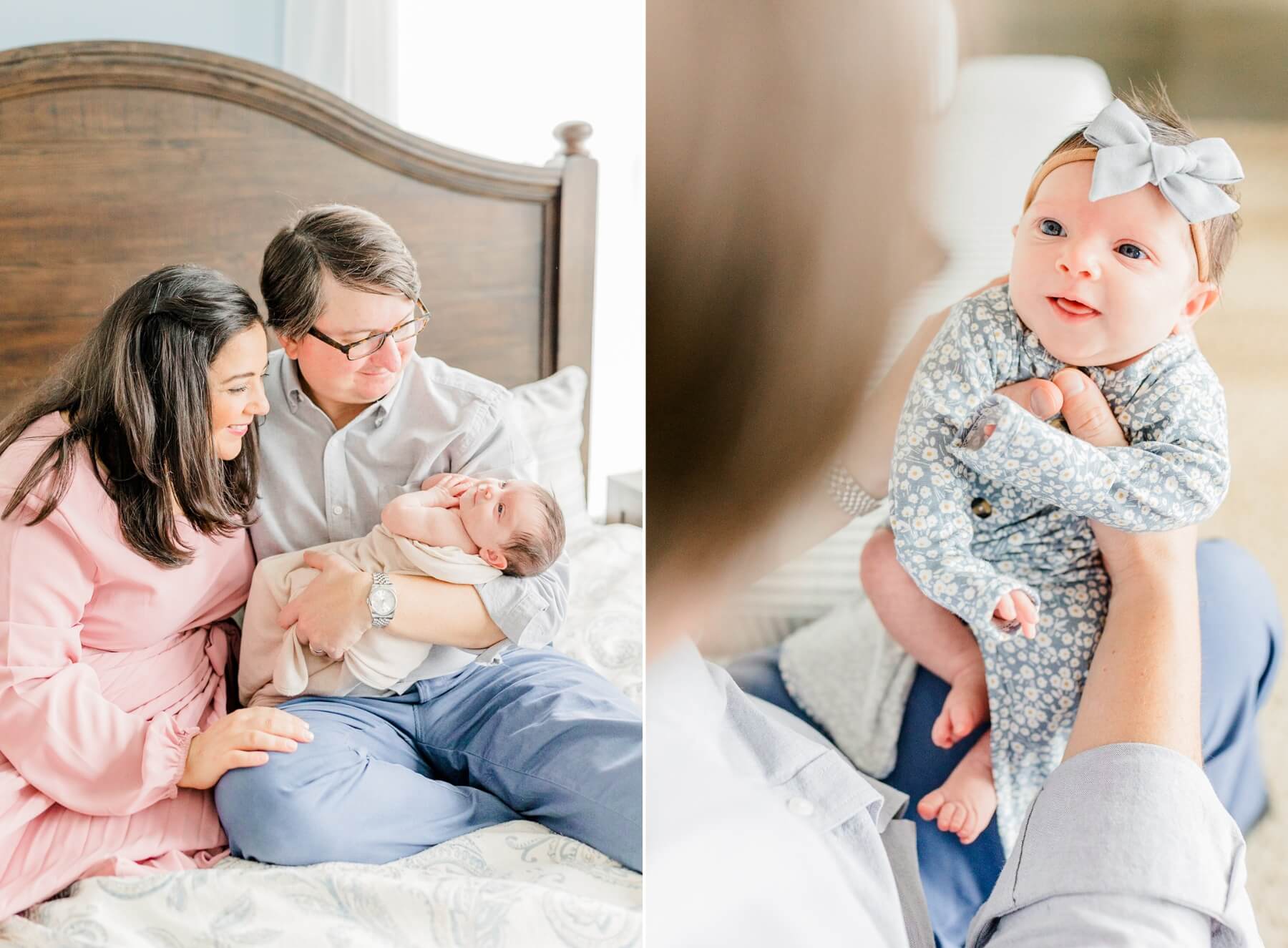 A mother and father smile down to their newborn baby in dad's arms while sitting on a bed by a window next to the baby in dad's lap smiling up to him in a floral onesie and bow from henry bear's park